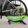 Állítható kerékpár parkoló állvány - Tartós műanyag, padlóra szerelhető kiállító állvány országúti és hegyi kerékpárokhoz biztonságos lábtámasz segítségével Zöld / Lila