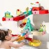 Interaktív vízi játékkészlet dinoszaurusz pályákkal, csúszdákkal és építőkockákkal